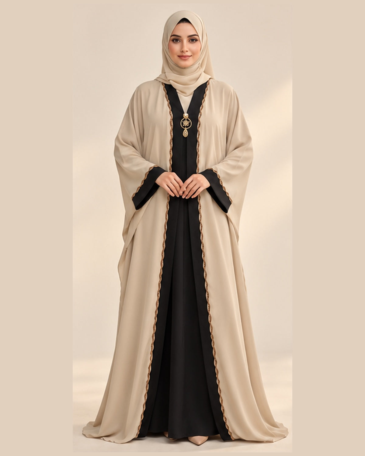 Cream abaya with black and gold pendant trim front view
