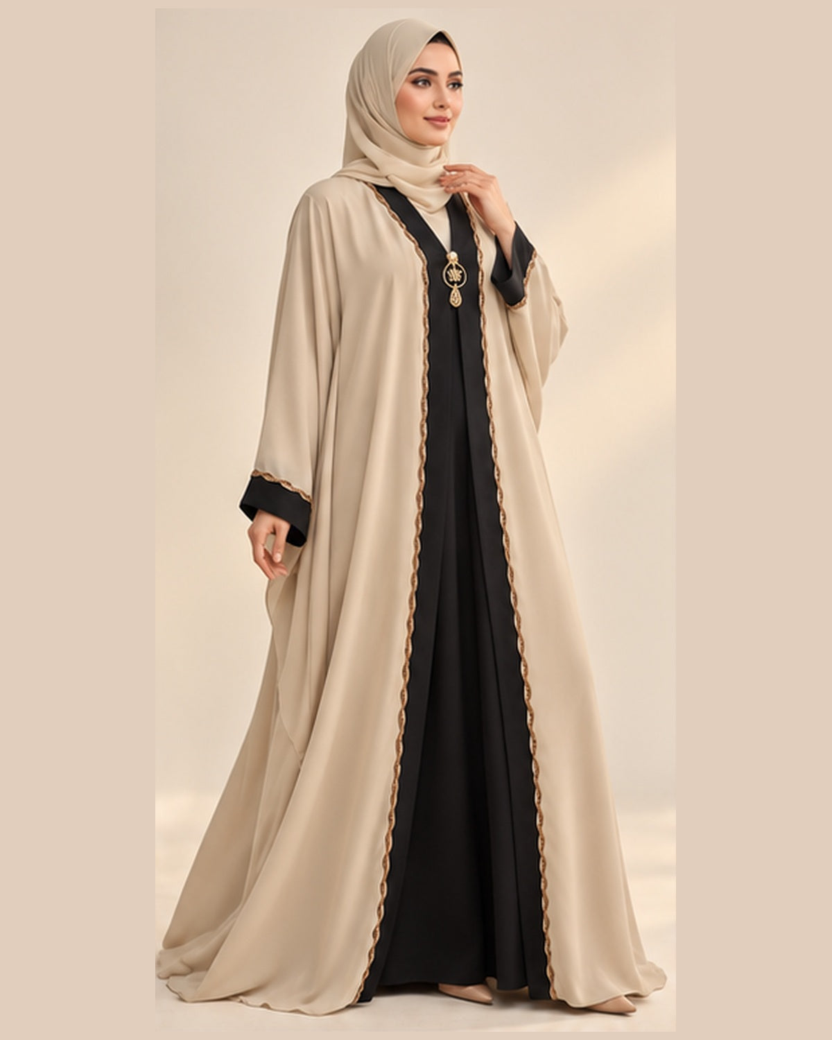 Cream abaya with black and gold pendant trim three-quarter view