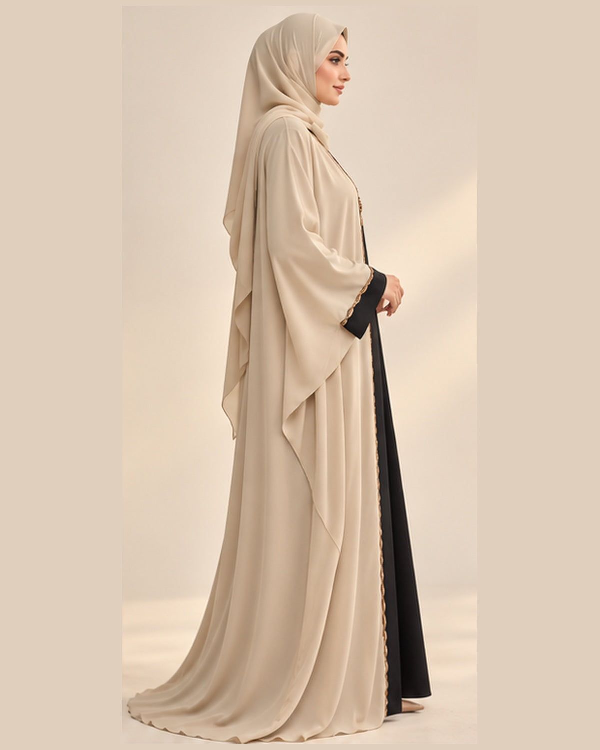 Cream abaya with black and gold pendant trim side view