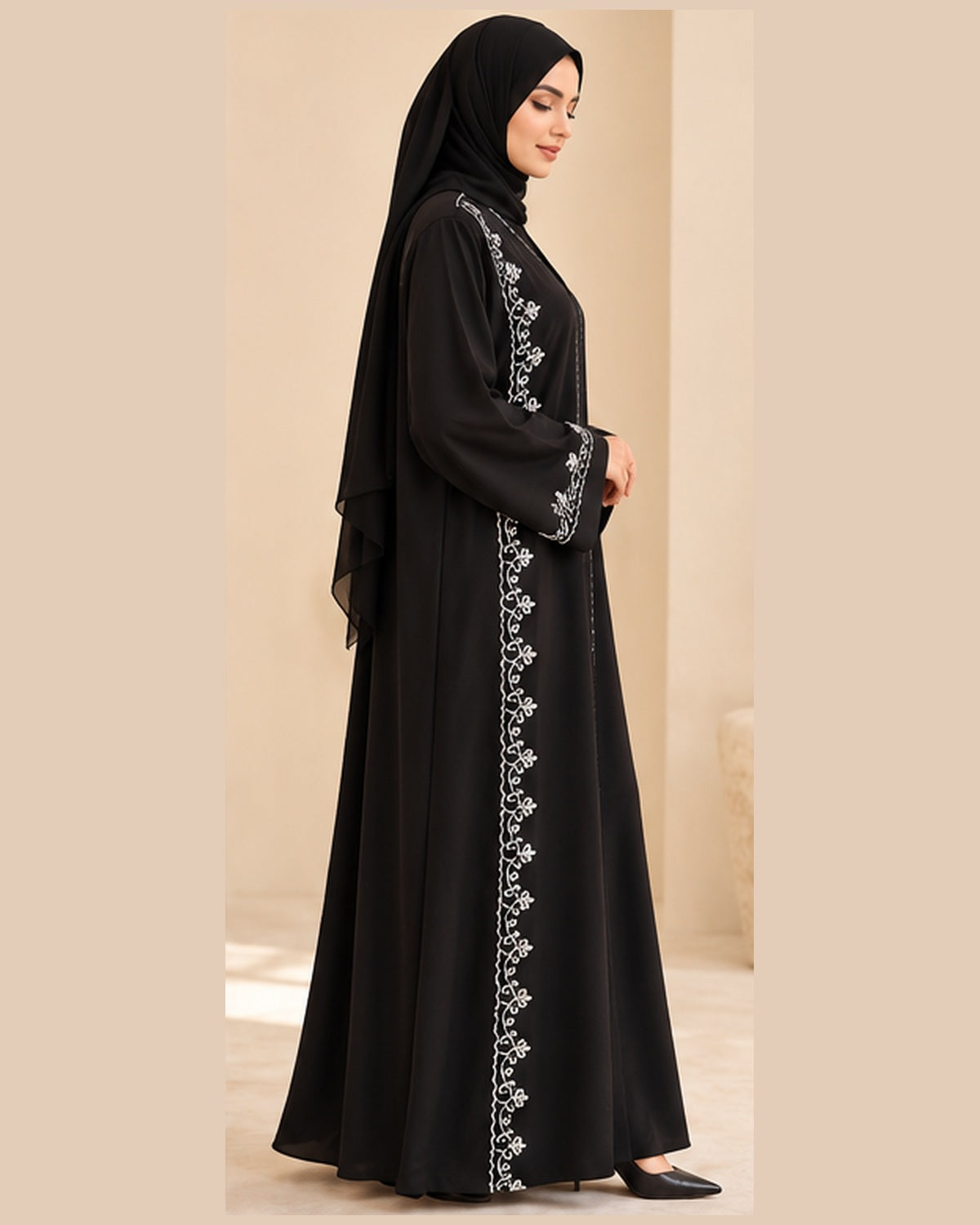 Black abaya side view with white vine trim