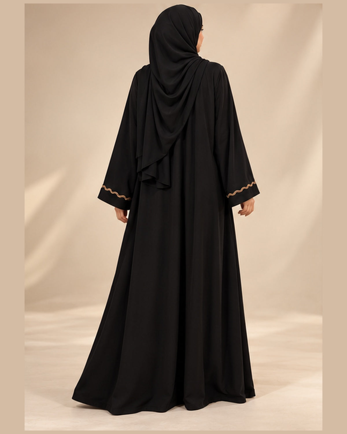 Black abaya with bronze wavy trim back view
