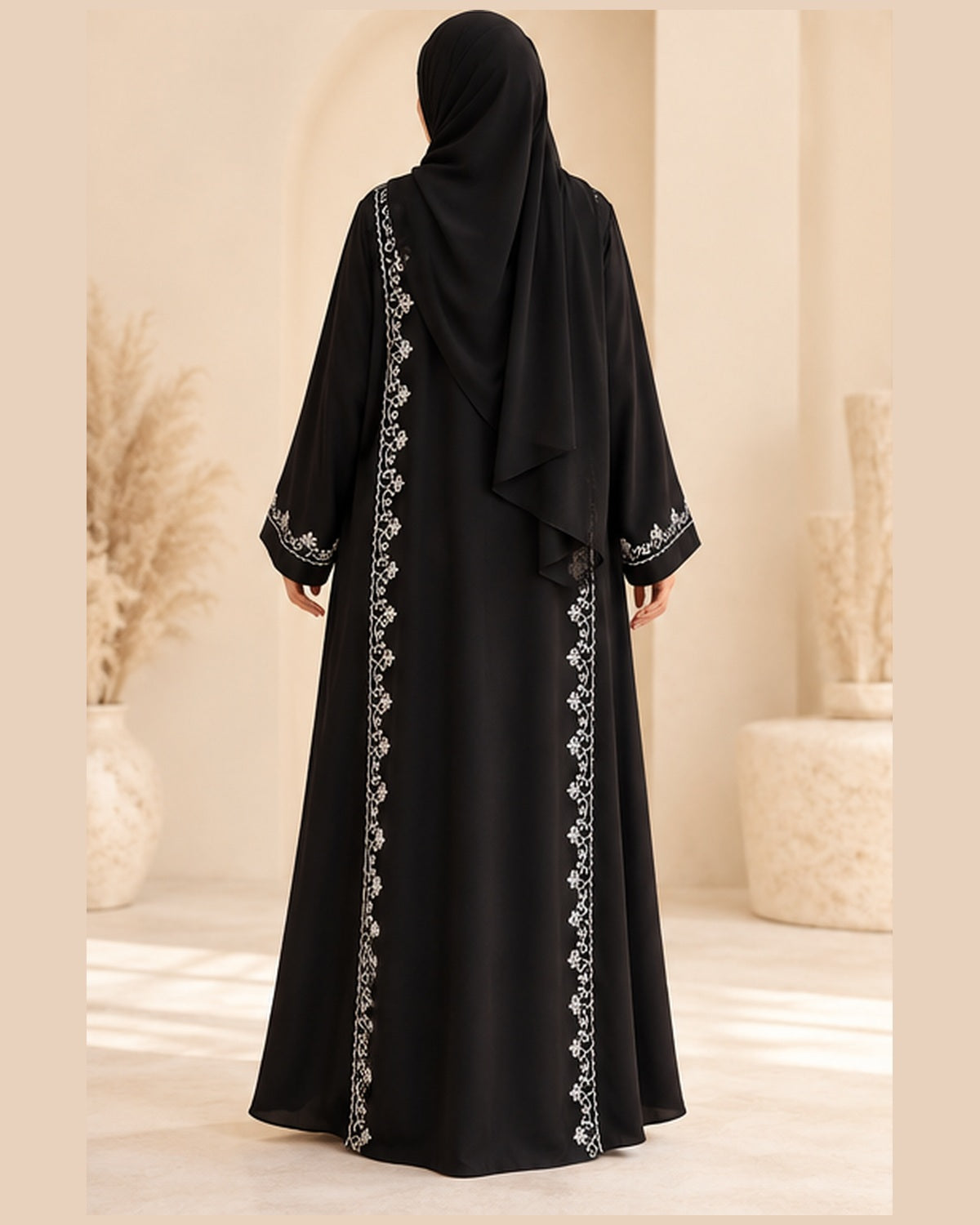 Black abaya back view with white vine trim