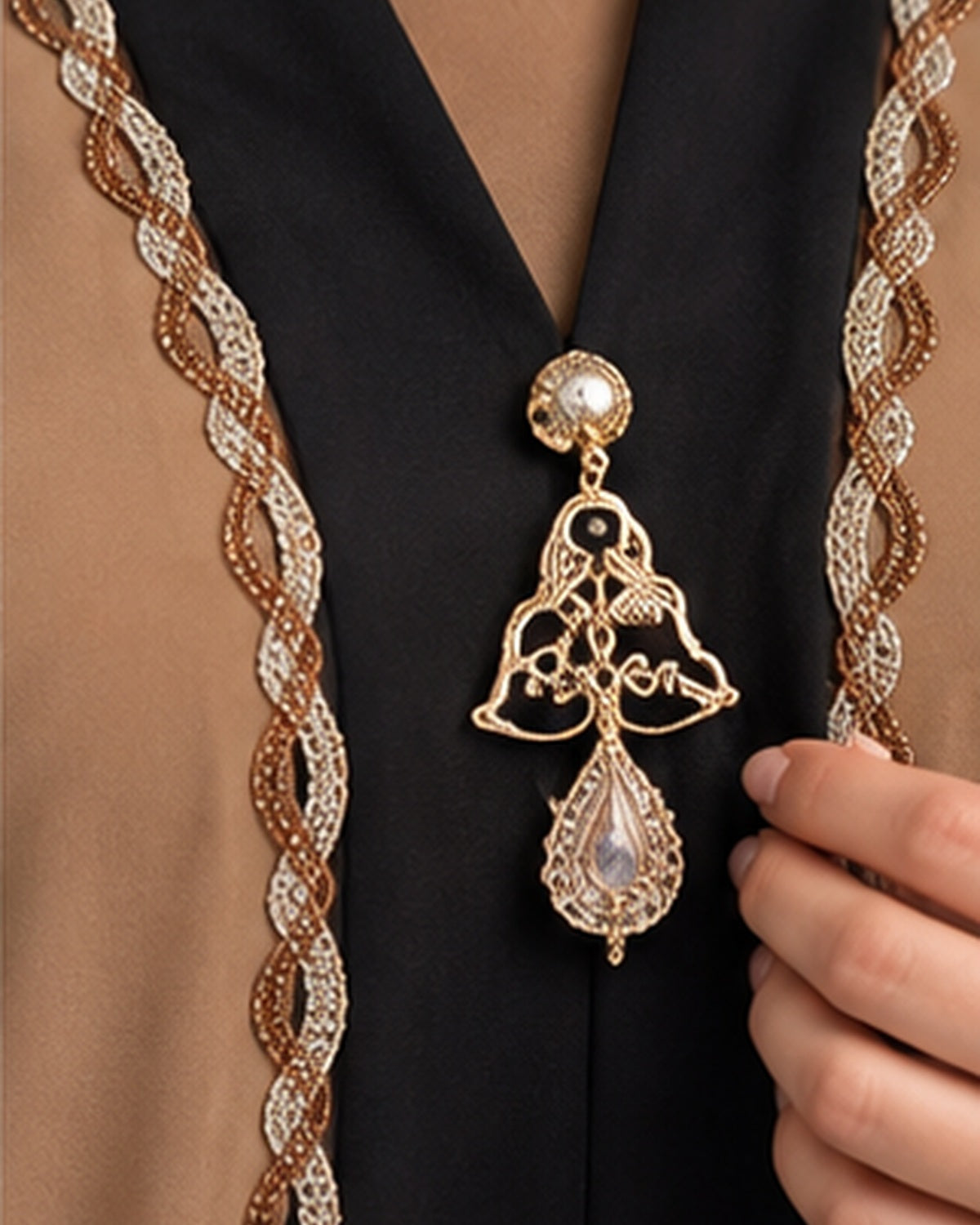 Camel abaya black center panel and gold pendant detail