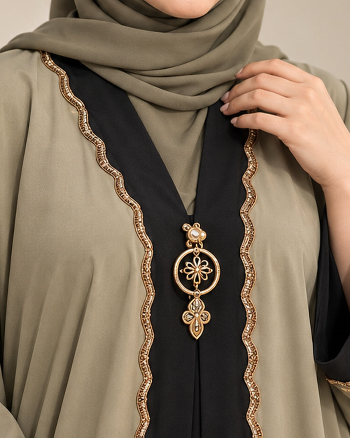 Olive abaya black center panel and gold pendant detail